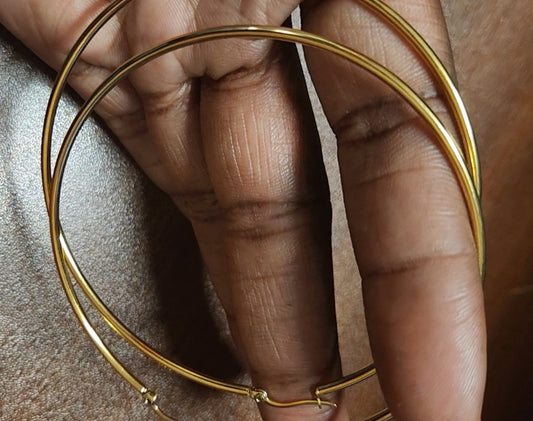 Gold tone thin large hoop earrings